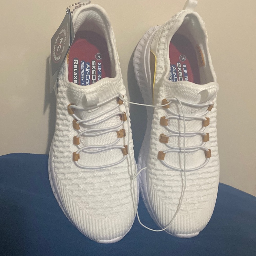 These are Sketchers white and gold size 8.5 all day wear.